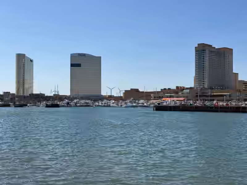 The two towers of Borgata Hotel Casino & Spa, one of them carrying the MGM sign, seen across the boats of the state marina in April 2025
