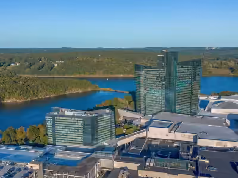 Aerial view of Mohegan Sun with the glass Sky Tower, the lower Earth Tower in front of it and the Thames River behind