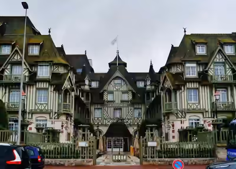 The entrance of Le Normandy hotel in Deauville, set between two half-timbered wings