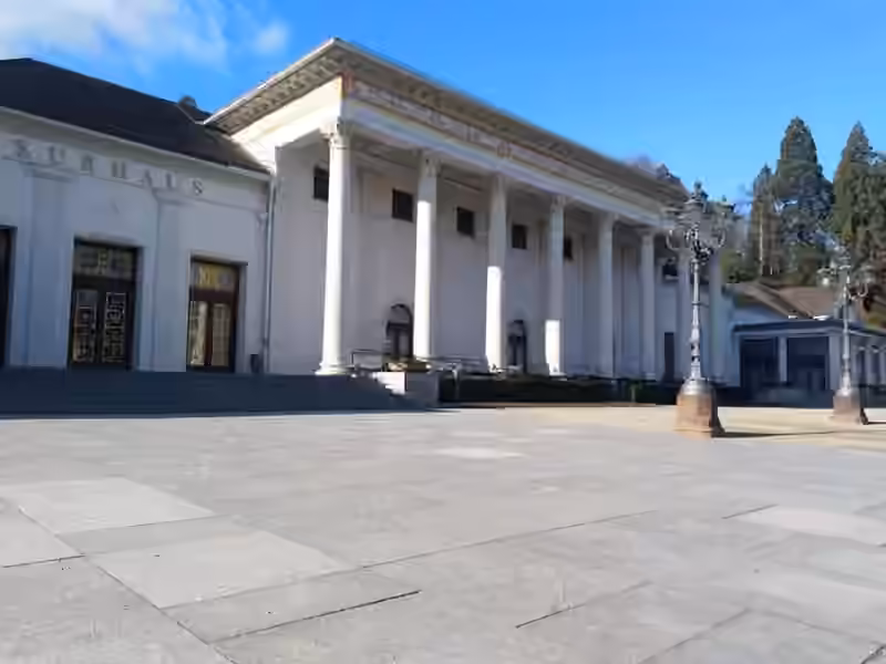 Entrance of the Kurhaus in Baden-Baden, with the word Casino above the doors and the columned portico beside it