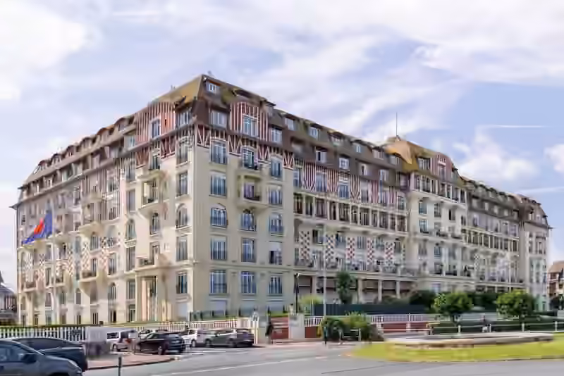 Hôtel Barrière Le Royal in Deauville, a long cream-coloured building with red and white half-timbered upper floors